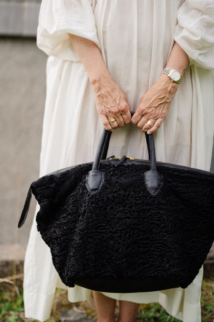 Black astrakhan curly-fur tote bag with leather handles