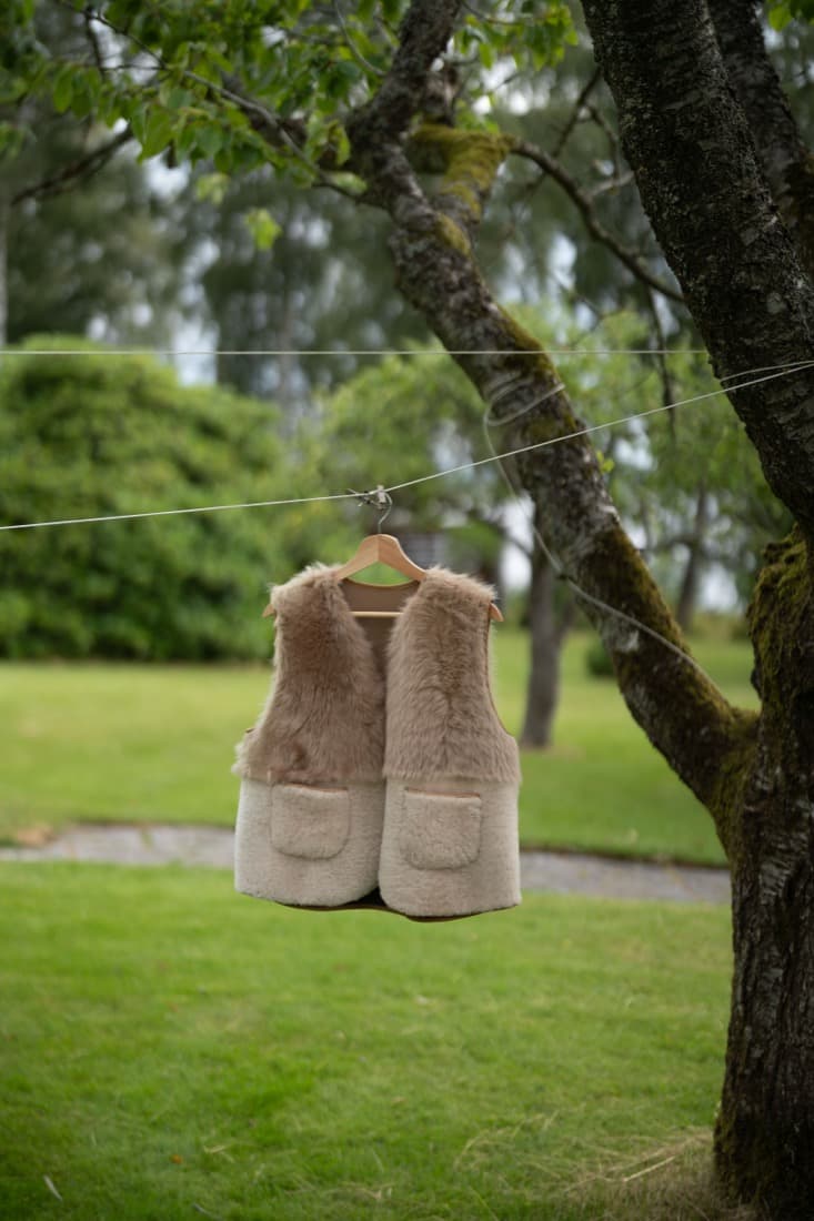 Two-tone sheepskin vest, cream wool body with taupe fur yoke and patch pockets